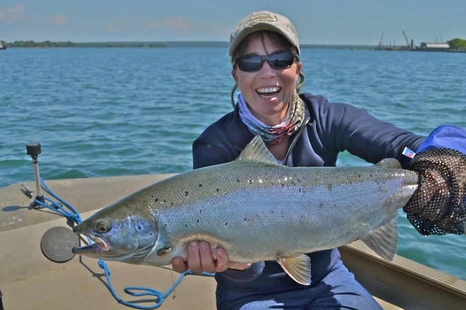 One of Petzke's clients appears satisfied with this particular Atlantic salmon from the St. Marys River. (Credit: Rivers North Guide Service)
