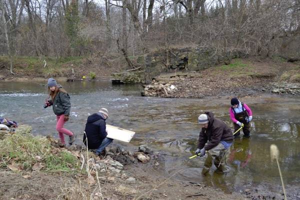 Students and faculty from the University of Delaware document the removal of the Byrnes Mill Dam along the White Clay Creek National Wild and Scenic River. (Credit: University of Delaware)